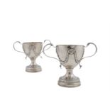 A PAIR OF GEORGIAN TWO HANDLED CUPS, in the Neo-Classical taste, London 1802, mark of Solomon