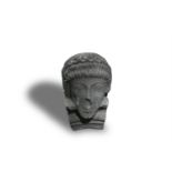 A CARVED STONE HEAD OF A CLASSICAL YOUTH, 28cm high, 17.5cm wideProvenance: Stackallen Co. Meath.