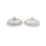 A PAIR OF SILVER PLATED ENTRÉE DISHES AND COVERS, each of shaped oval form, with gadrooned rim and