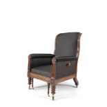 A WILLIAM IV MAHOGANY FRAMED AND HORSEHAIR UPHOLSTERED LIBRARY ARMCHAIR, the arms carved with