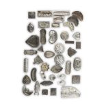 A LARGE COLLECTION OF PEWTER CHOCOLATE MOULDS, in the form of shells, fish, shapes etc.