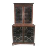 A LATE 19TH CENTURY MAHOGANY BOOKCASE, with moulded dentil cornice above twin astragal glazed