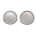 A PAIR OF VICTORIAN SILVER SALVERS (EN SUITE TO THE PREVIOUS LOT), London 1893 and 1894, mark of