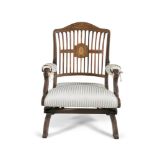 A 19TH CENTURY MAHOGANY AND MARQUETRY INLAID ROCKING CHAIR, with arched twelve bar back centred with