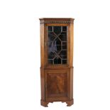 ***WITHDRAWN***A MAHOGANY CORNER CABINET IN THE GEORGIAN STYLE, with Gothic arch blind fret