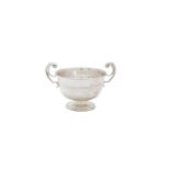 A SILVER TWO HANDLED PRESENTATION CUP, London 1911, mark of Mappin & Webb Ltd, modelled as a