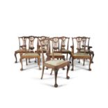 A SET OF EIGHT MAHOGANY CHIPPENDALE REVIVAL DINING CHAIRS, comprising two carvers and six single