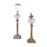 A BRASS COLUMN OIL LAMP, converted to electricity, the clear glass reservoir raised on a square