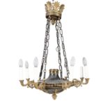 A REGENCY STYLE BLACK AND GILT METAL EIGHT BRANCH CEILIING LIGHT, with leaf corona, and circular