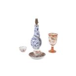 A COLLECTION OF ORIENTAL PORCELAIN, comprising a Chinese 19th century blue and white vase, converted