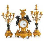 A Lot of One French Bronze Clock and Pair of Candlesticks