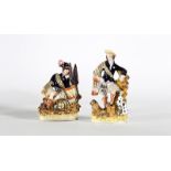 “Escoceses”. Pareja de figuras de loza esmaltada. Staffordshire, Inglaterra, S. XIX. Medidas: 27 x