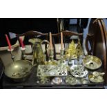 Two pairs of brass candlesticks; a brass rectangular trivet; a brass ewer; & various other items