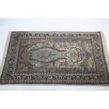 A Persian pattern rug of ivory & pale blue ground, with multi-coloured geometric, floral & animal