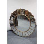 A reproduction gilt frame “Sunburst” wall mirror, 39” diameter.