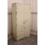 A mid-20th century Milner’s cream painted art-metal industrial tall cabinet fitted three shelves