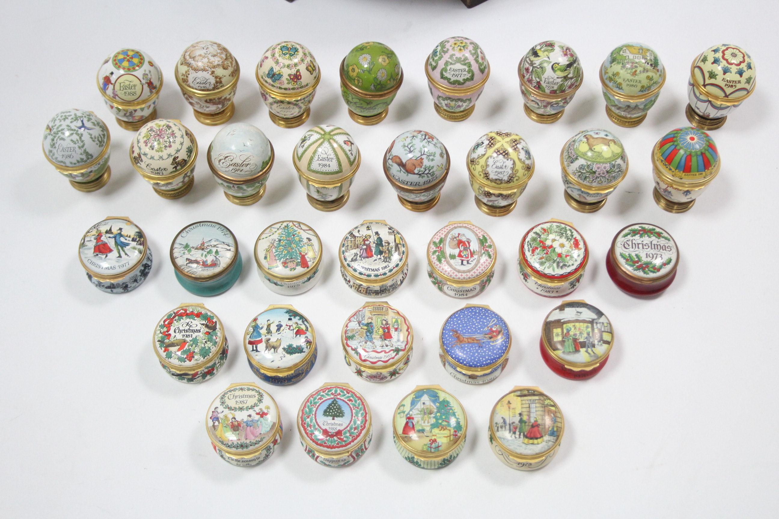 A collection of sixteen Halcyon Days enamelled Christmas boxes, & sixteen ditto egg-shaped boxes, - Image 3 of 4