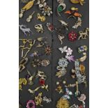 A collection of sixty-one various costume jewellery brooches; & various other items of costume