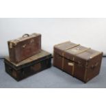 A fibre-covered travelling trunk with hinged lift-lid & with leather handles, 33” wide; a steal