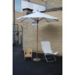 A garden parasol with base; a sun lounger; & a rattan child’s conservatory chair.