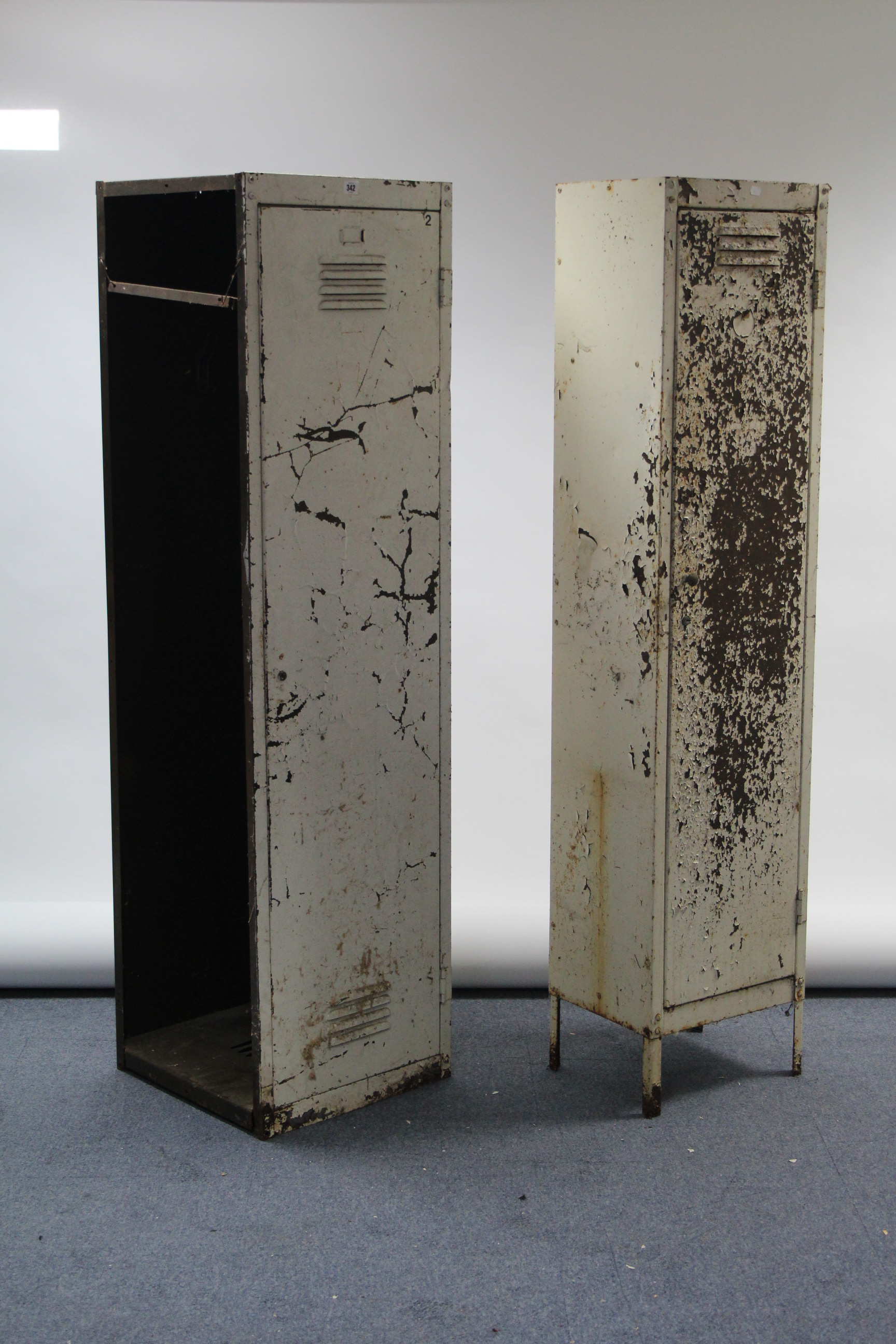 Two mid-20th century white painted art-metal industrial lockers, each fitted shelf enclosed by door,