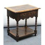 A reproduction oak lowboy fitted frieze drawer, & on bobbin-turned legs & turned feet with open