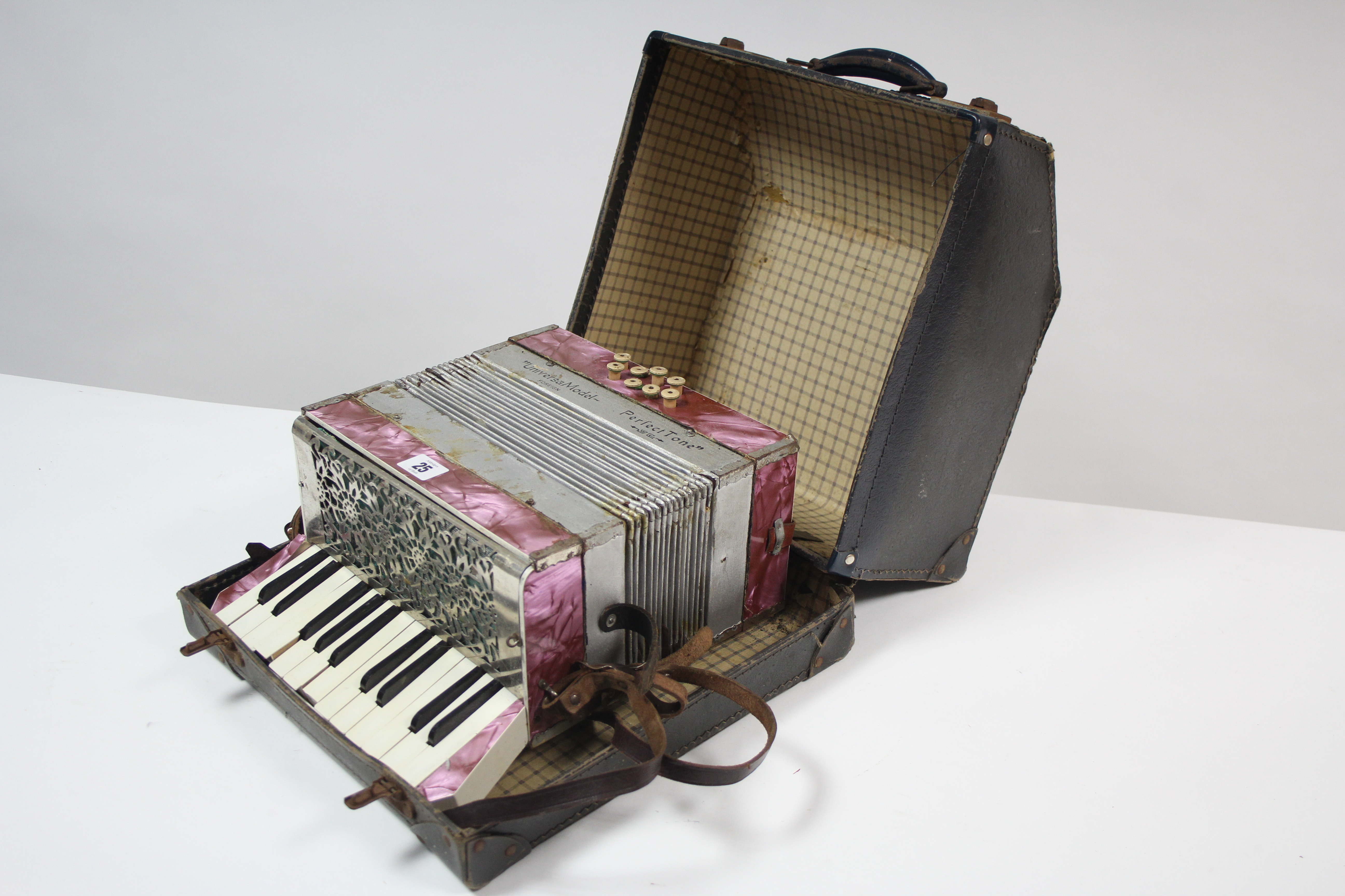 A "Universa" model Perfect Tone piano accordion, with carrying case.