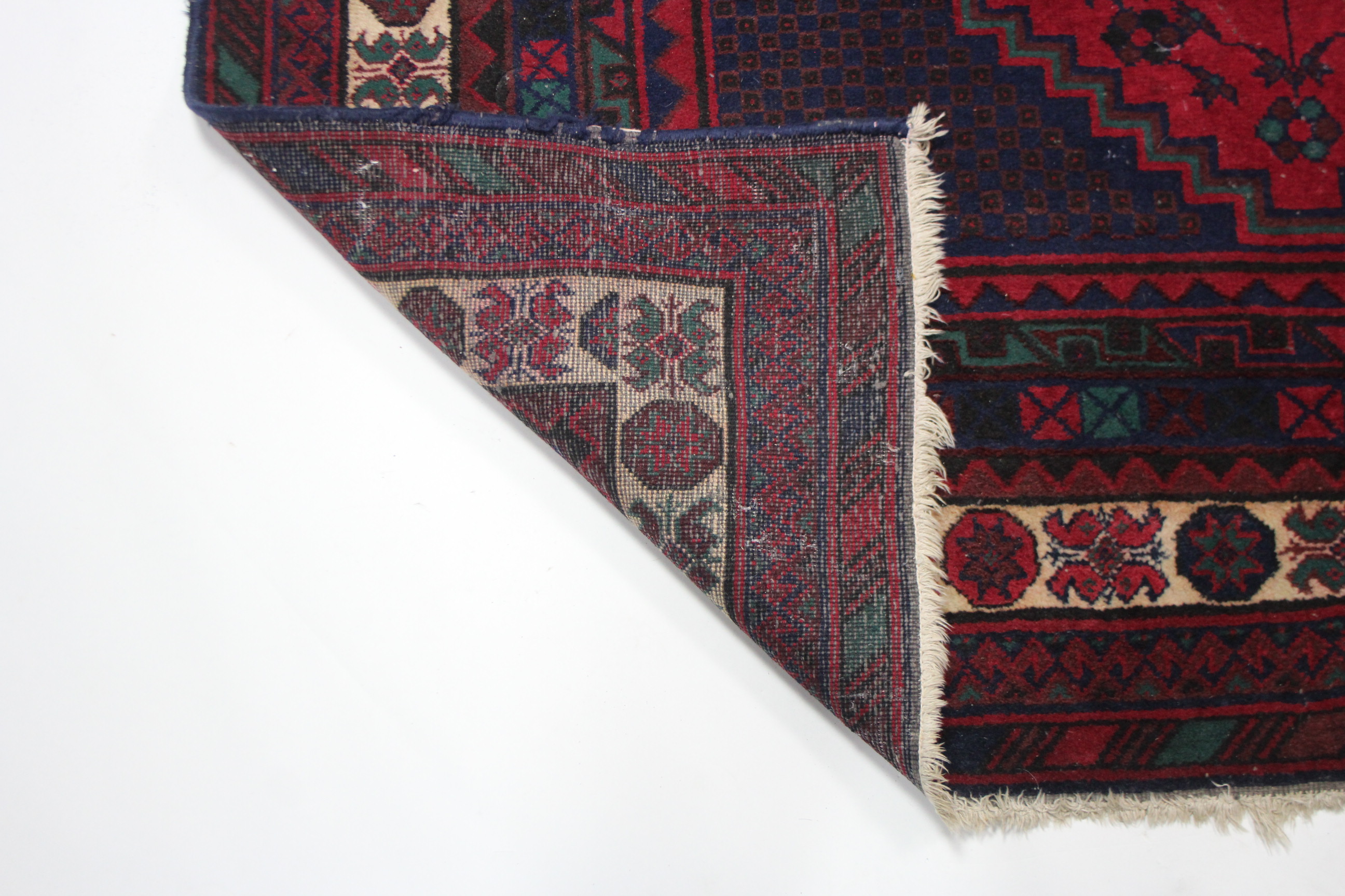 A Persian pattern small carpet of crimson deep blue ground, with geometrical design to centre within - Image 3 of 3