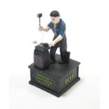 A reproduction painted cast-iron “John Deare” money box, 9¼” high.