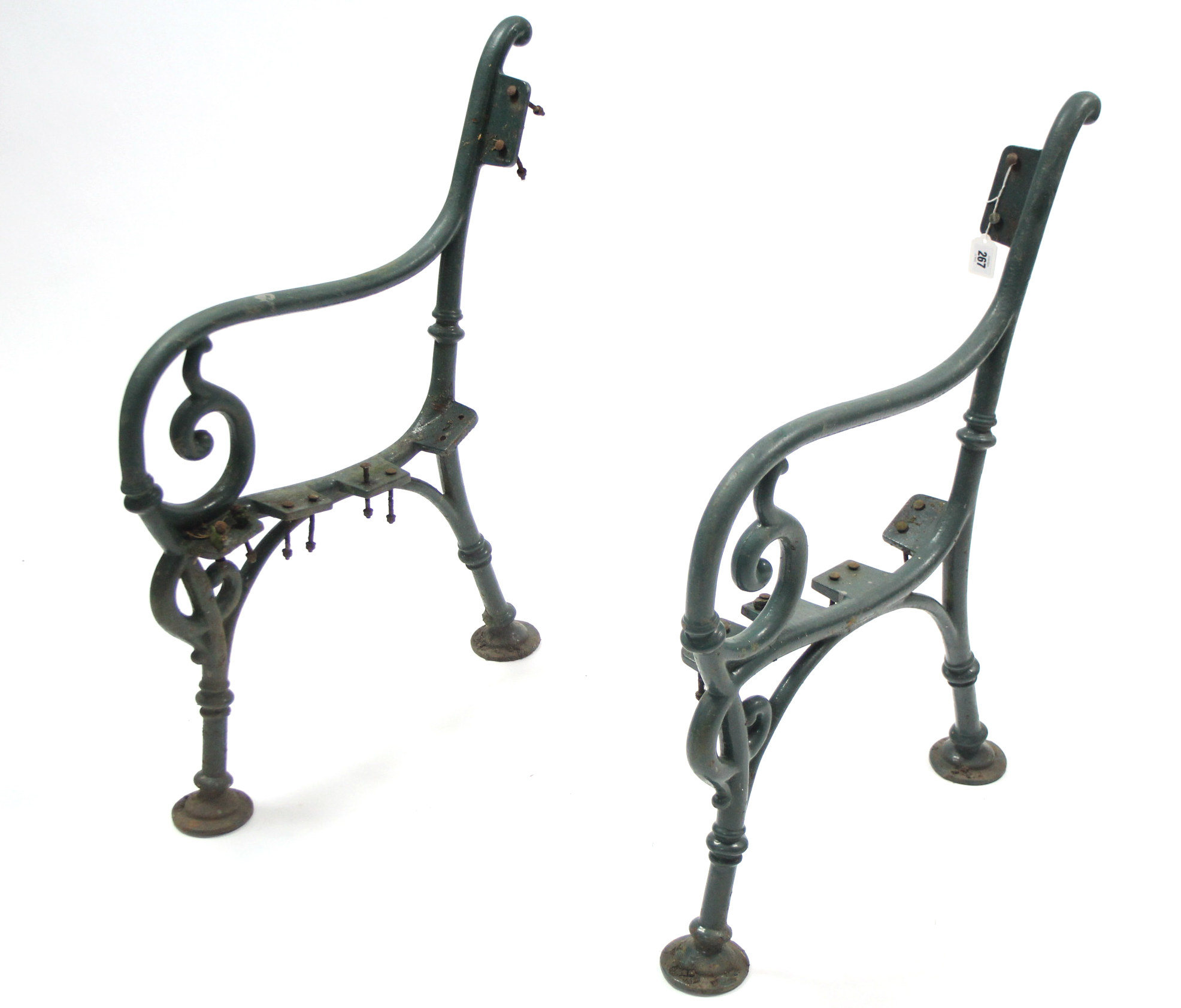 A pair of green painted cast-iron garden bench end supports of scroll design, 32” high.