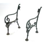 A pair of green painted cast-iron garden bench end supports of scroll design, 32” high.