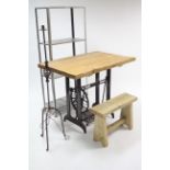 A Singer treadle sewing machine base with later pine top, 39¼” wide; together with a silvered-