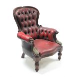 A Victorian-style buttoned-back armchair upholstered brass-studded crimson leatherette, & on short