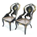 A pair of late 19th century black papier mâche occasional chairs with all-over mother of pearl