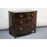 AN EARLY 19th CENTURY MAHOGANY LOW BOW-FRONT CHEST, fitted two short, two long graduated drawers
