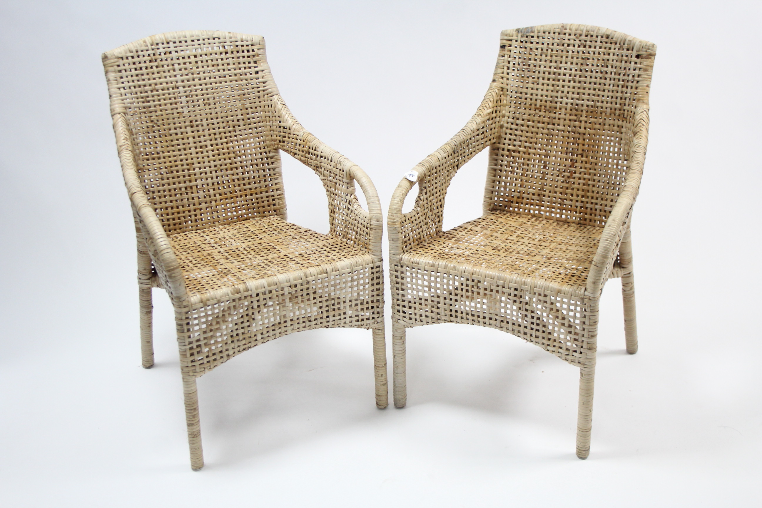 A pair of Ikea “Majby” wicker conservatory chairs.