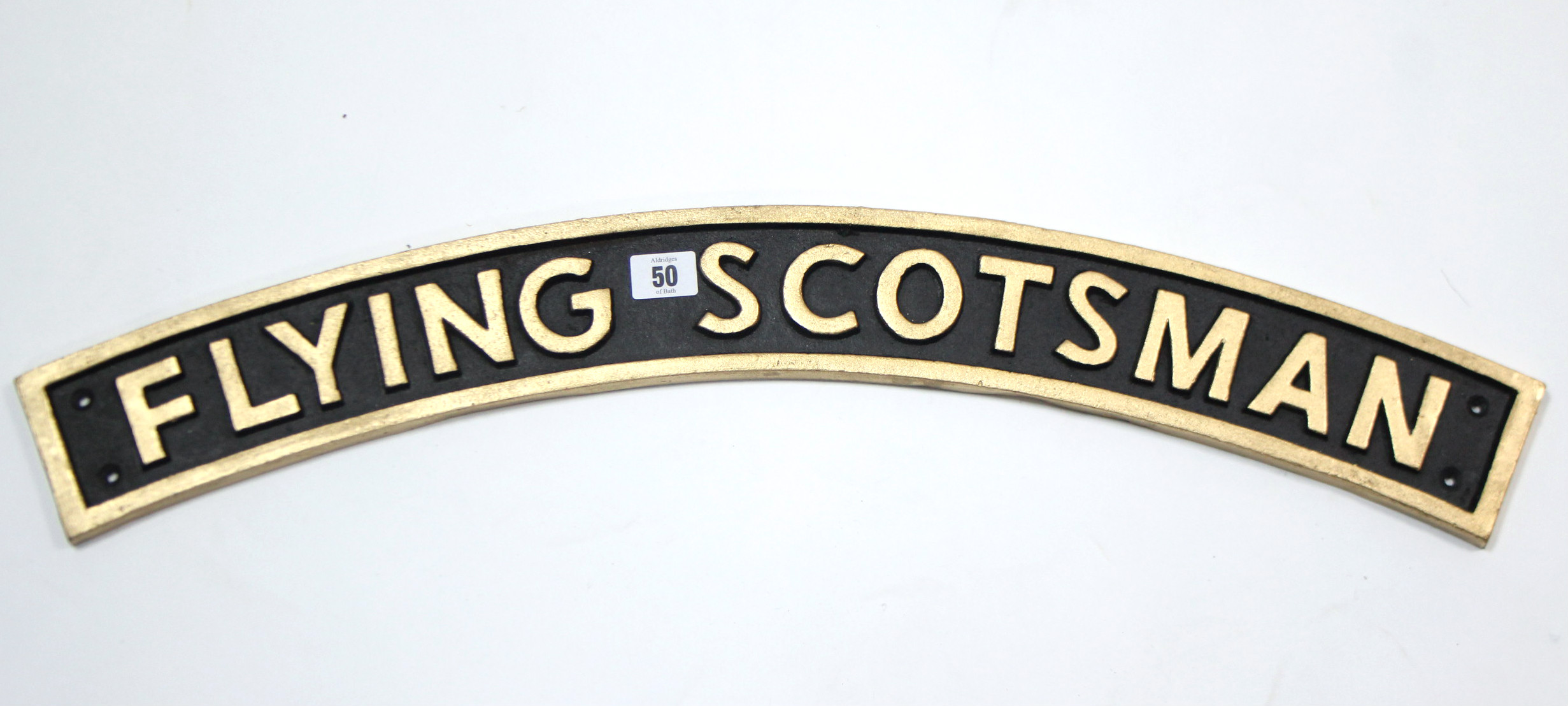 A reproduction painted cast-iron sign “FLYING SCOTSMAN”, 28¼” long.