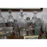 Five glass receptacles, each with silver top; a plated cigarette case; various items of plated