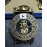 A reproduction brass lantern clock; four table lamp bases; a resin dog ornament; & sundry other