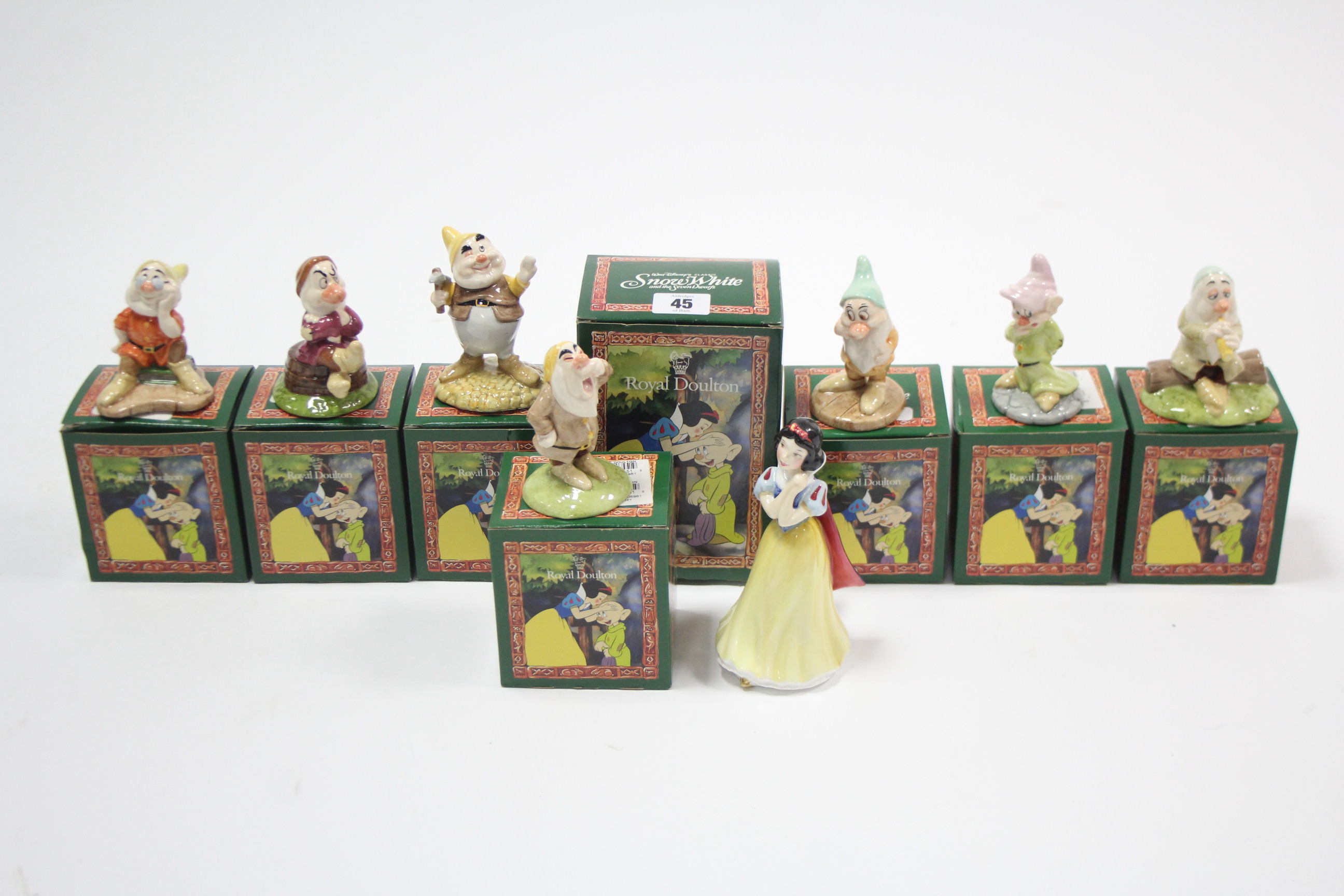 A set of eight Royal Doulton “Snow White & the seven dwarfs” character figures, all boxed.