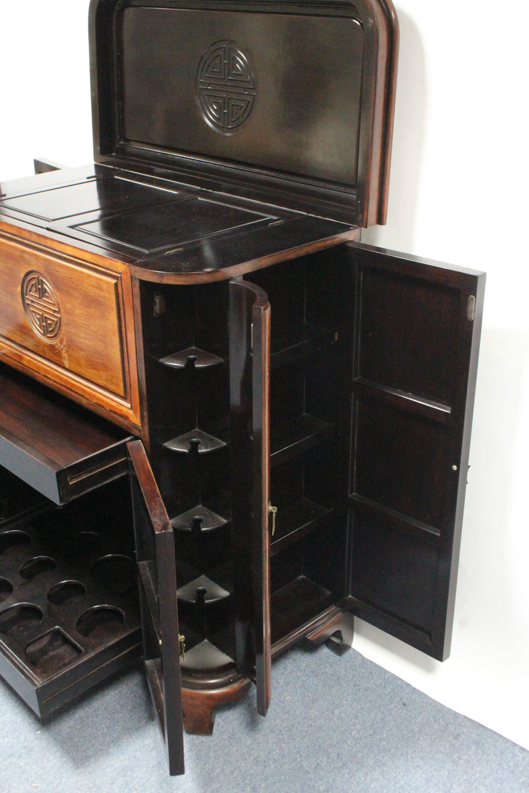 An early/mid-20th century Chinese carved hardwood drinks cabinet with lift top & fall front, - Image 4 of 8