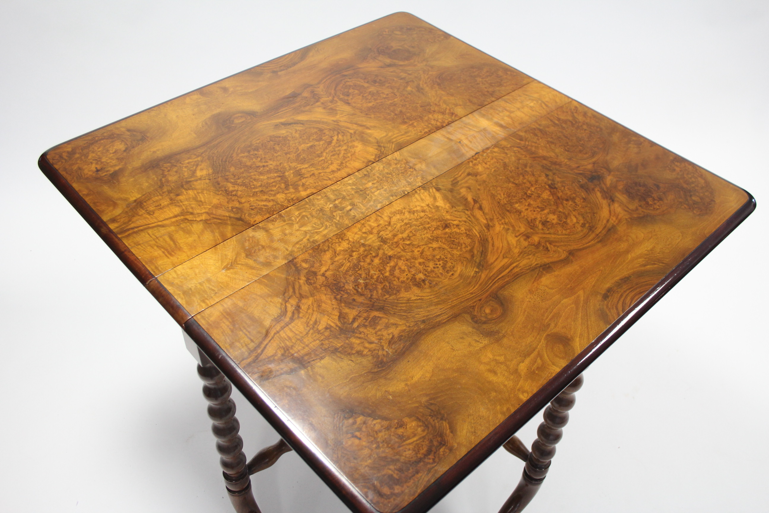 A Victorian burr-walnut Sutherland table on bobbin-turned supports with curved legs; 36” wide. - Image 4 of 4