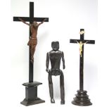 A finely carved boxwood Corpus Christi mounted on an ebonised crucifix, 27” high over-all; an