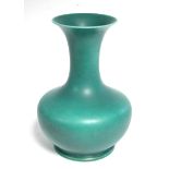 A Pilkington Royal Lancastrian baluster vase of emerald green ground, with trumpet-shaped neck;