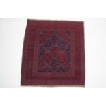 A Kazak rug of crimson, deep blue & ivory ground with geometric lozenge design within multiple