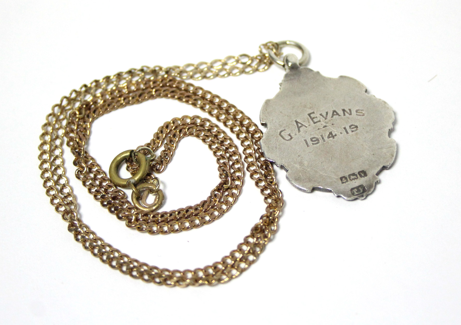 A 9ct. gold chain necklace of flat curb links (7.4gm); & a silver pendant fob - Image 2 of 2
