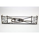 An early 19th century wrought-iron window balcony, with scroll decoration & ball finials; 55”
