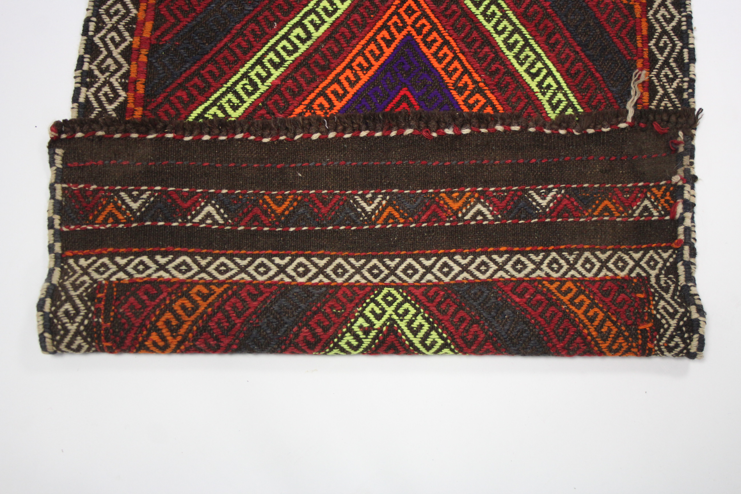 A Suzni Kelim runner of bright multi-coloured geometric design, with row of four lozenges within - Image 2 of 3