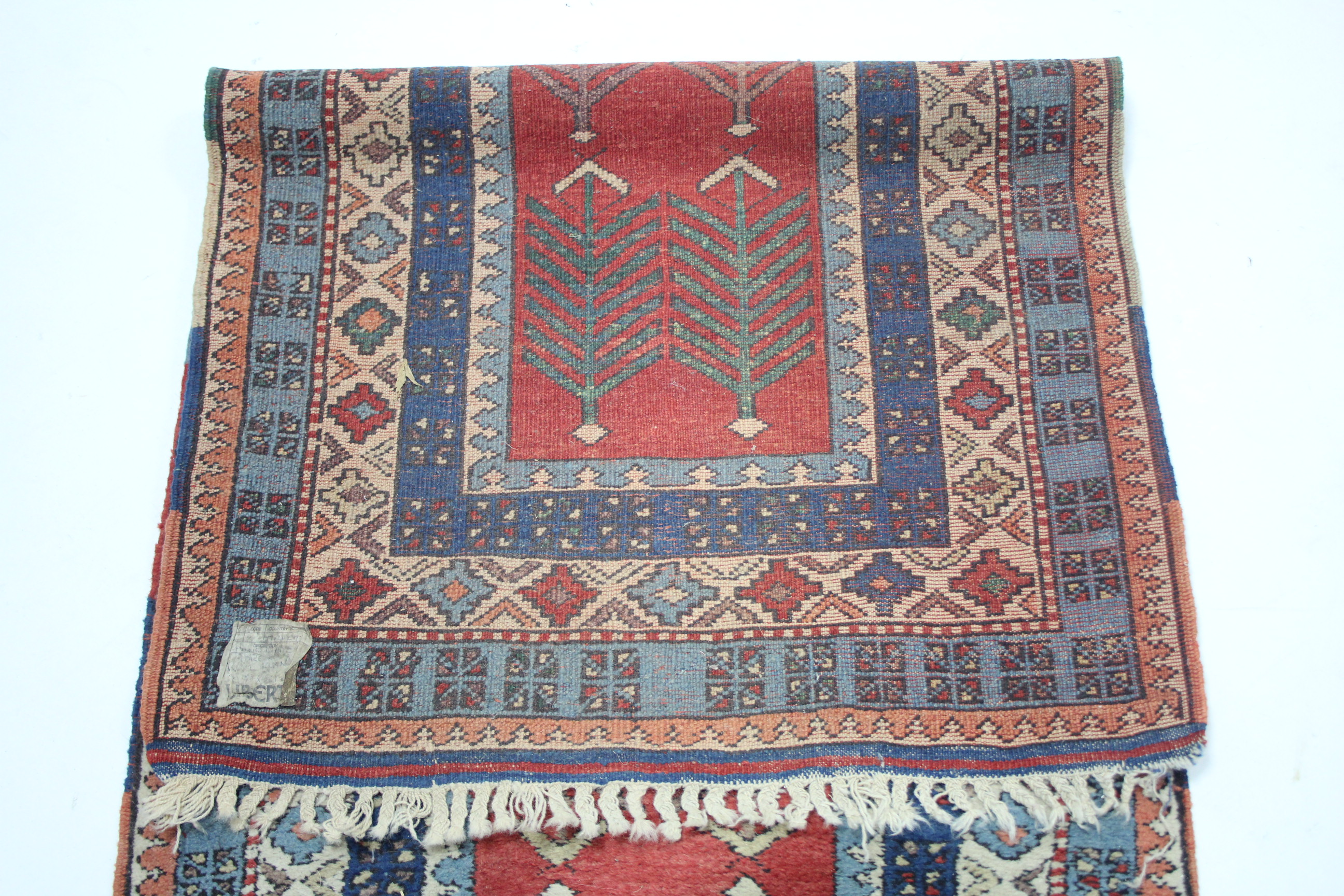 A Turkish corridor runner retailed by Liberty, of crimson ground with two rows of repeating herring - Image 2 of 4