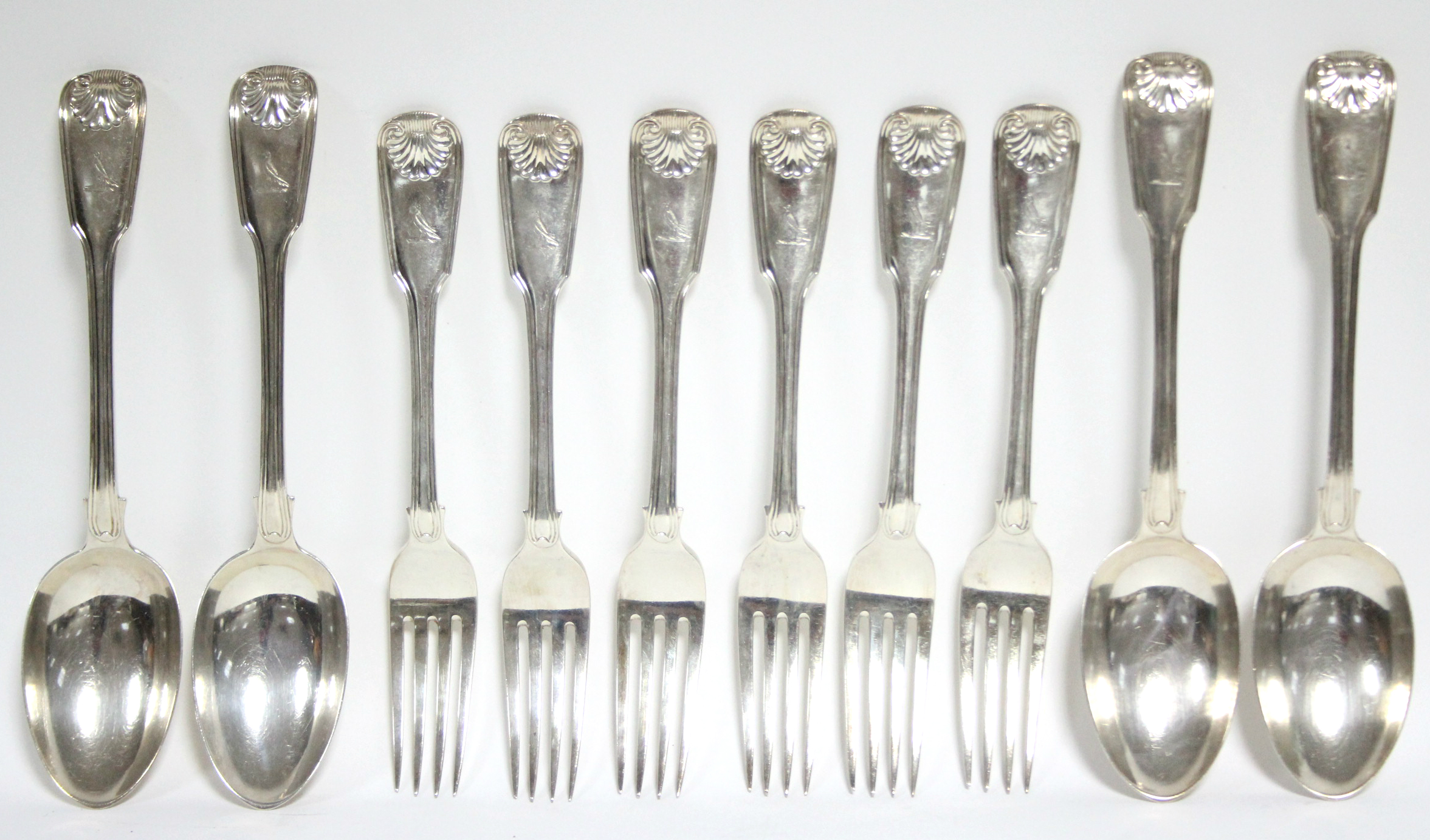 Six Victorian Fiddle, Shell, & Thread pattern table forks; & four matching table spoons; London